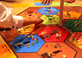 Image of a person moving a game piece